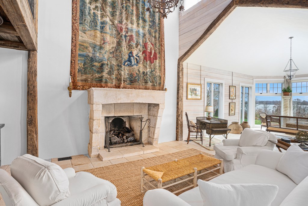 256 East Shore Road Jamestown, RI 02835 - Photo 6 of 40 LIVING ROOM WITH FRENCH LIMESTONE GAS FIREPLACE. CATHEDRAL CEILINGS