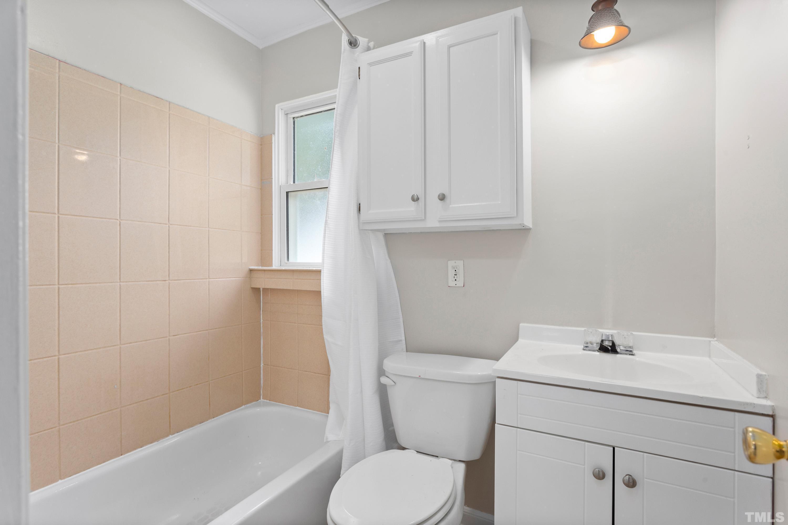 143 Spring Park Road Wake Forest, NC 27587 - Photo 13 of 29 a bathroom with a sink a toilet and bathtub