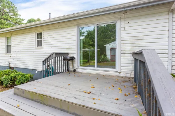 a view of a backyard with a deck