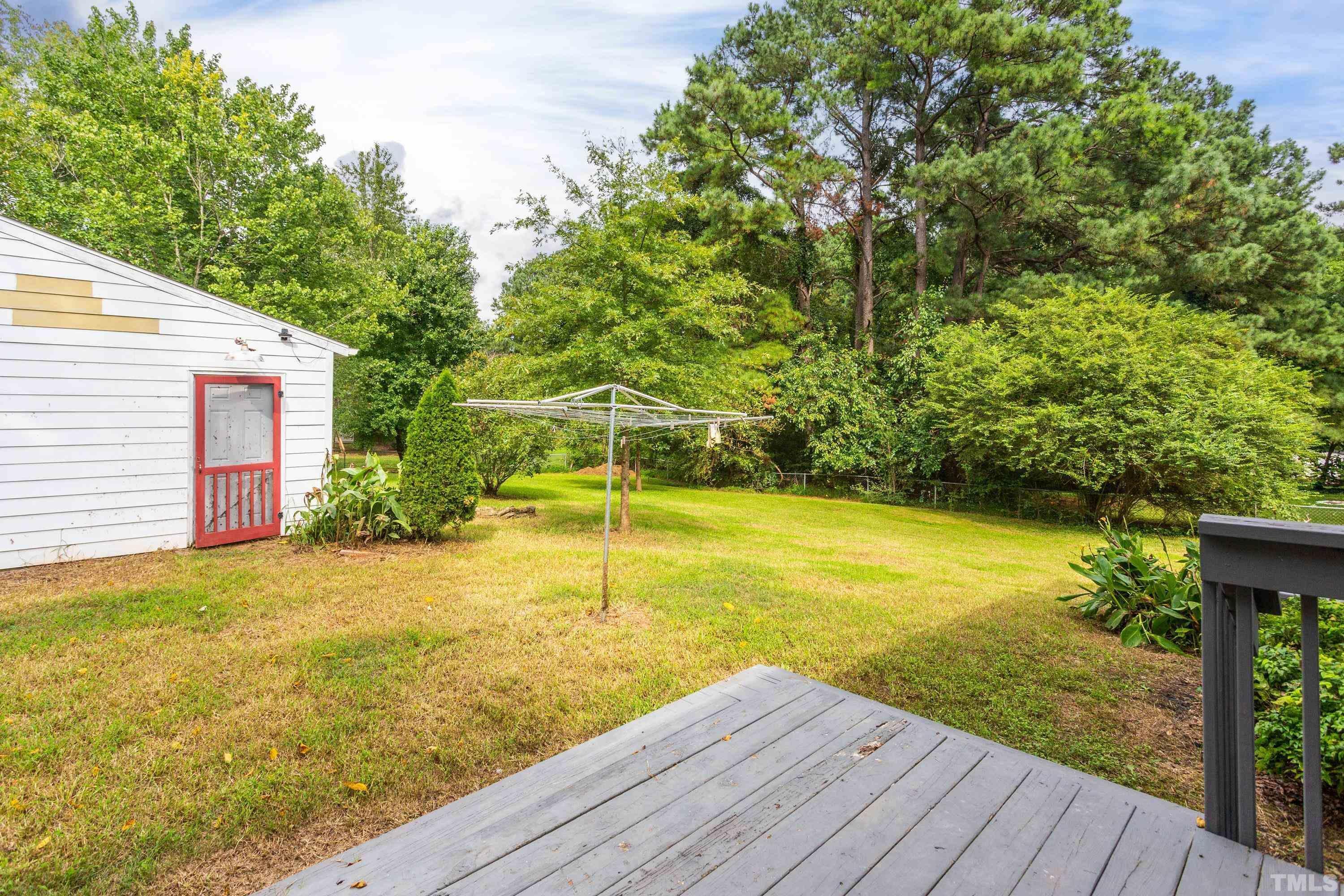 143 Spring Park Road Wake Forest, NC 27587 - Photo 17 of 29 a view of a yard with an outdoor space