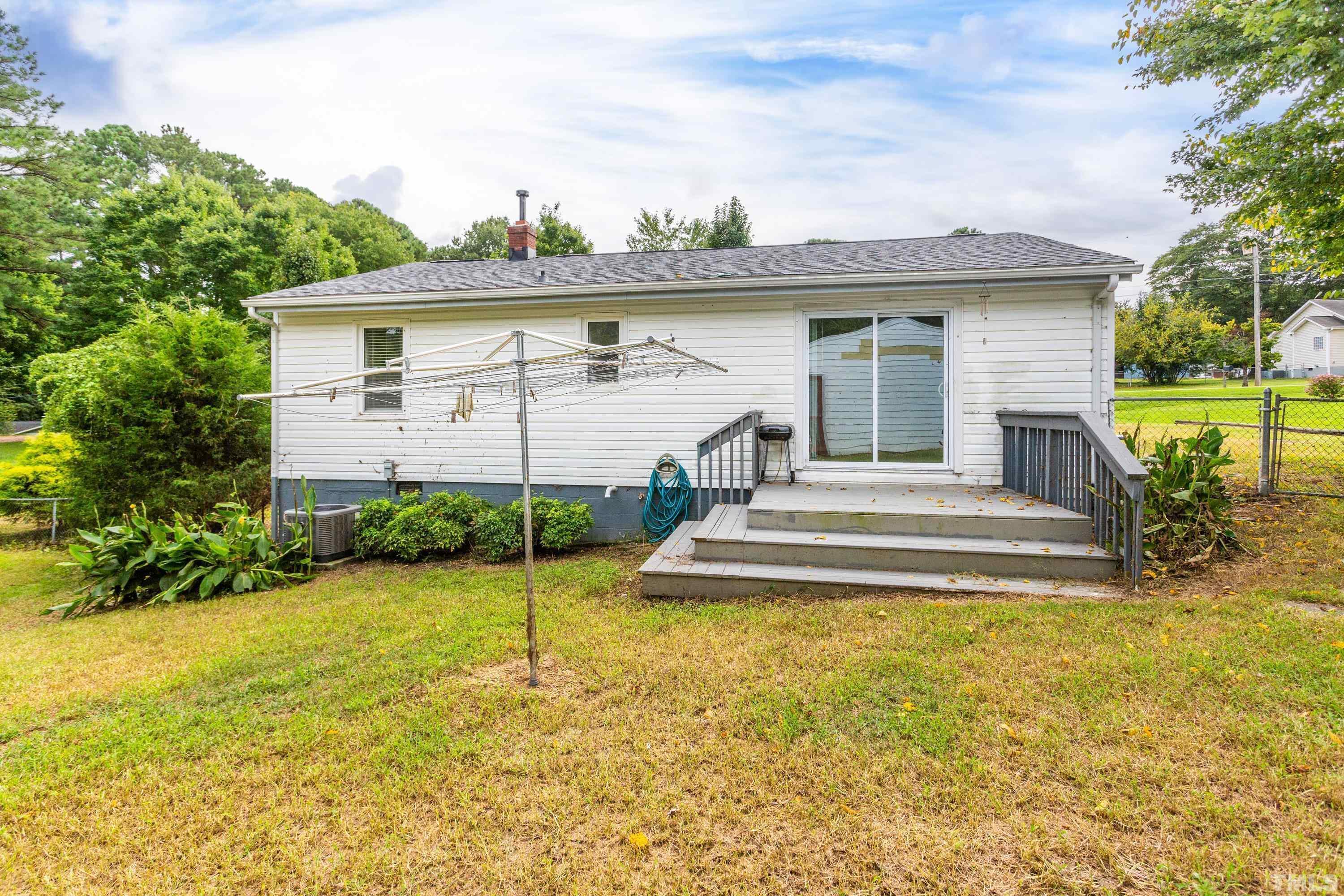 143 Spring Park Road Wake Forest, NC 27587 - Photo 18 of 29 a view of house with swimming pool and garden