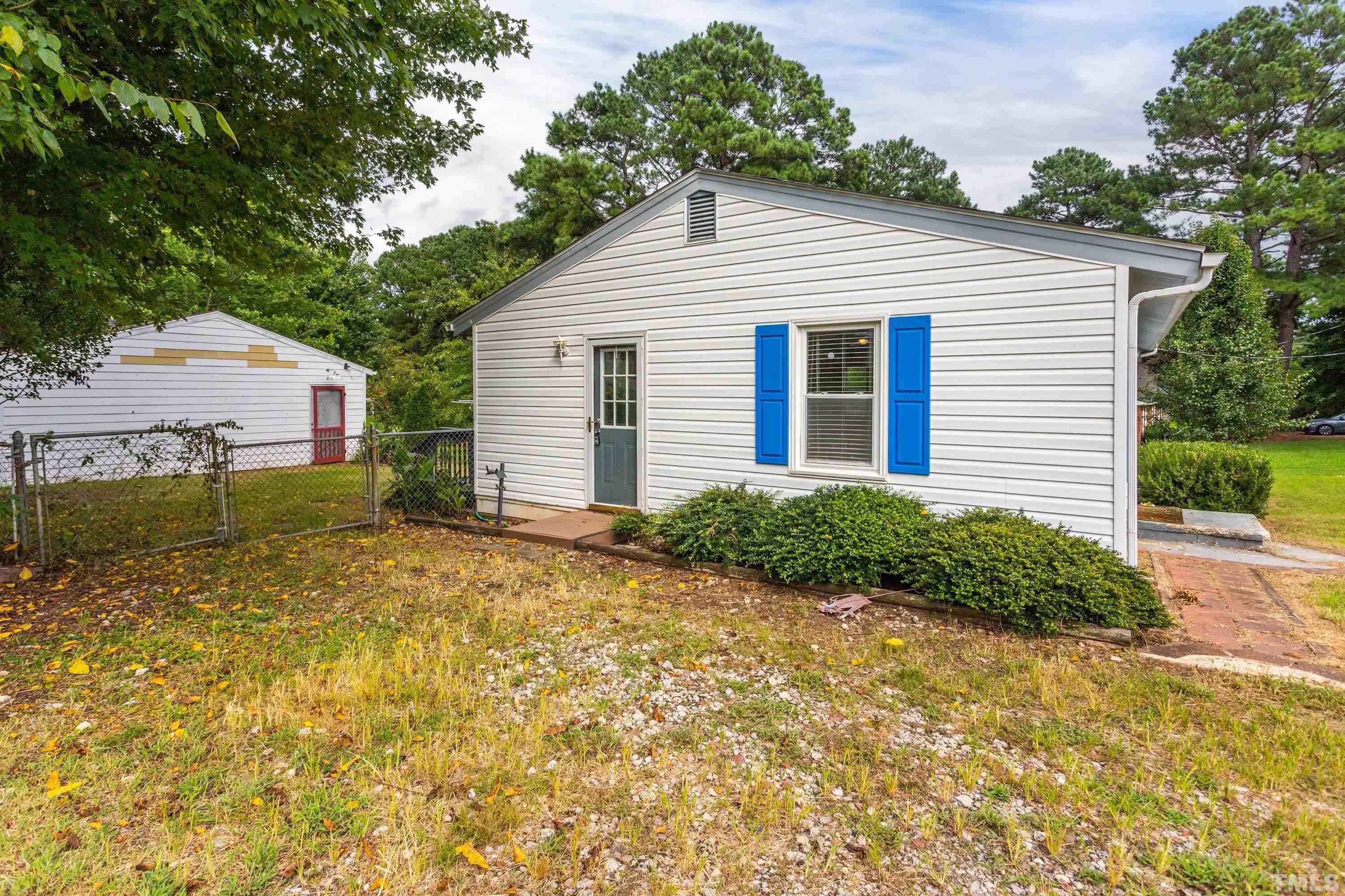 143 Spring Park Road Wake Forest, NC 27587 - Photo 19 of 29 a view of backyard of house with green space
