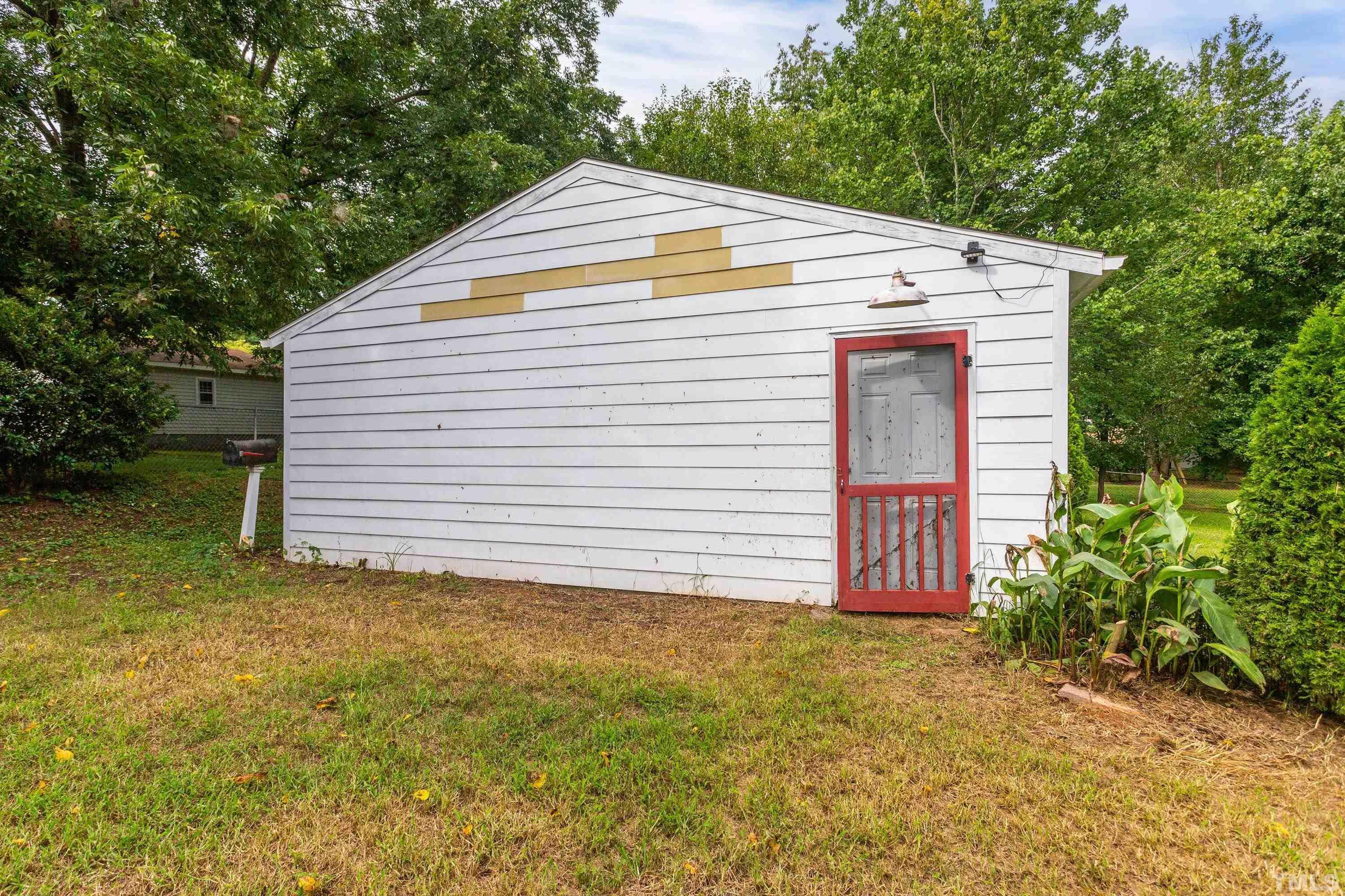 143 Spring Park Road Wake Forest, NC 27587 - Photo 21 of 29 a view of a house with a yard and garage