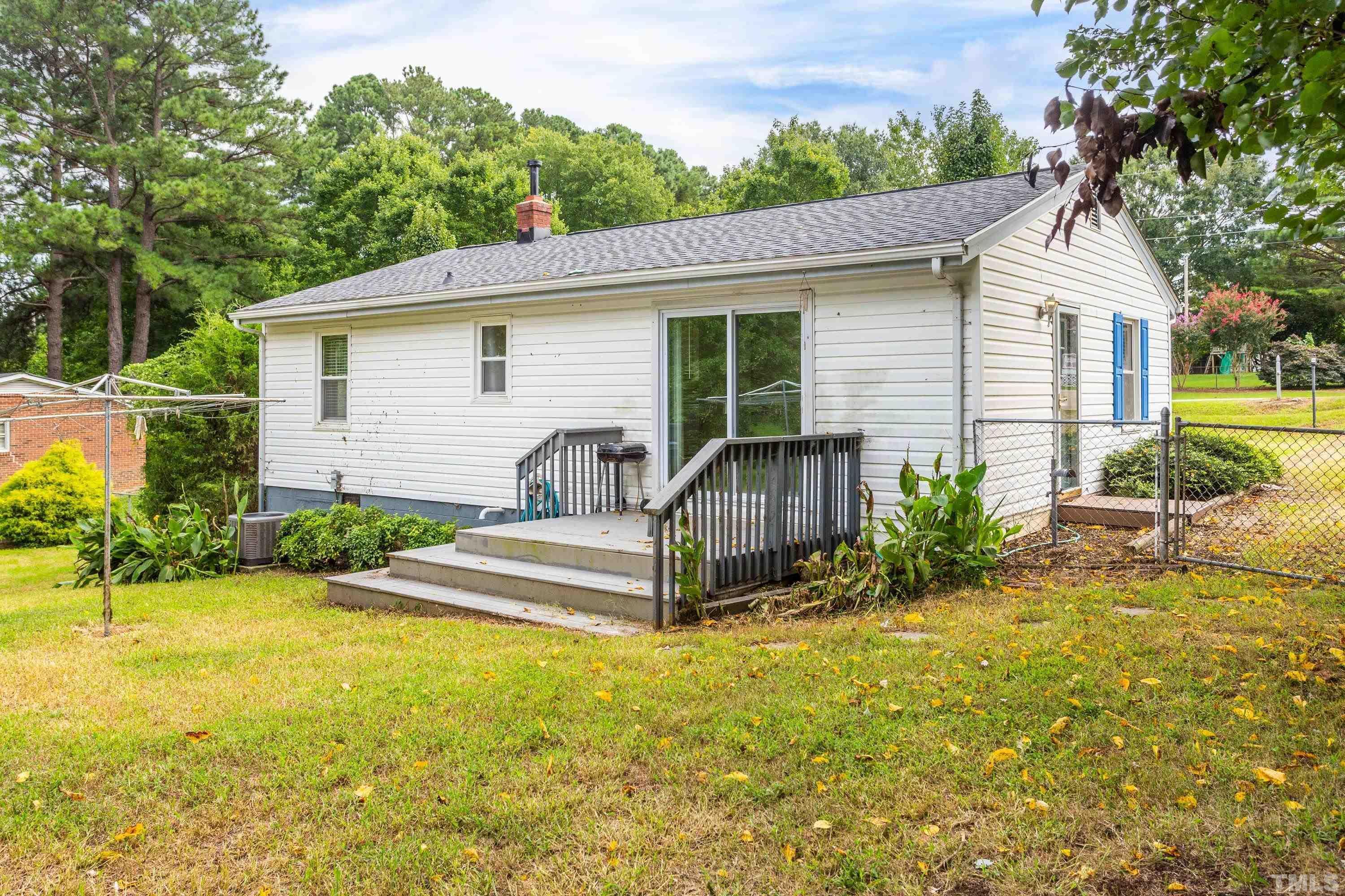 143 Spring Park Road Wake Forest, NC 27587 - Photo 23 of 29 a view of a house with pool and chairs