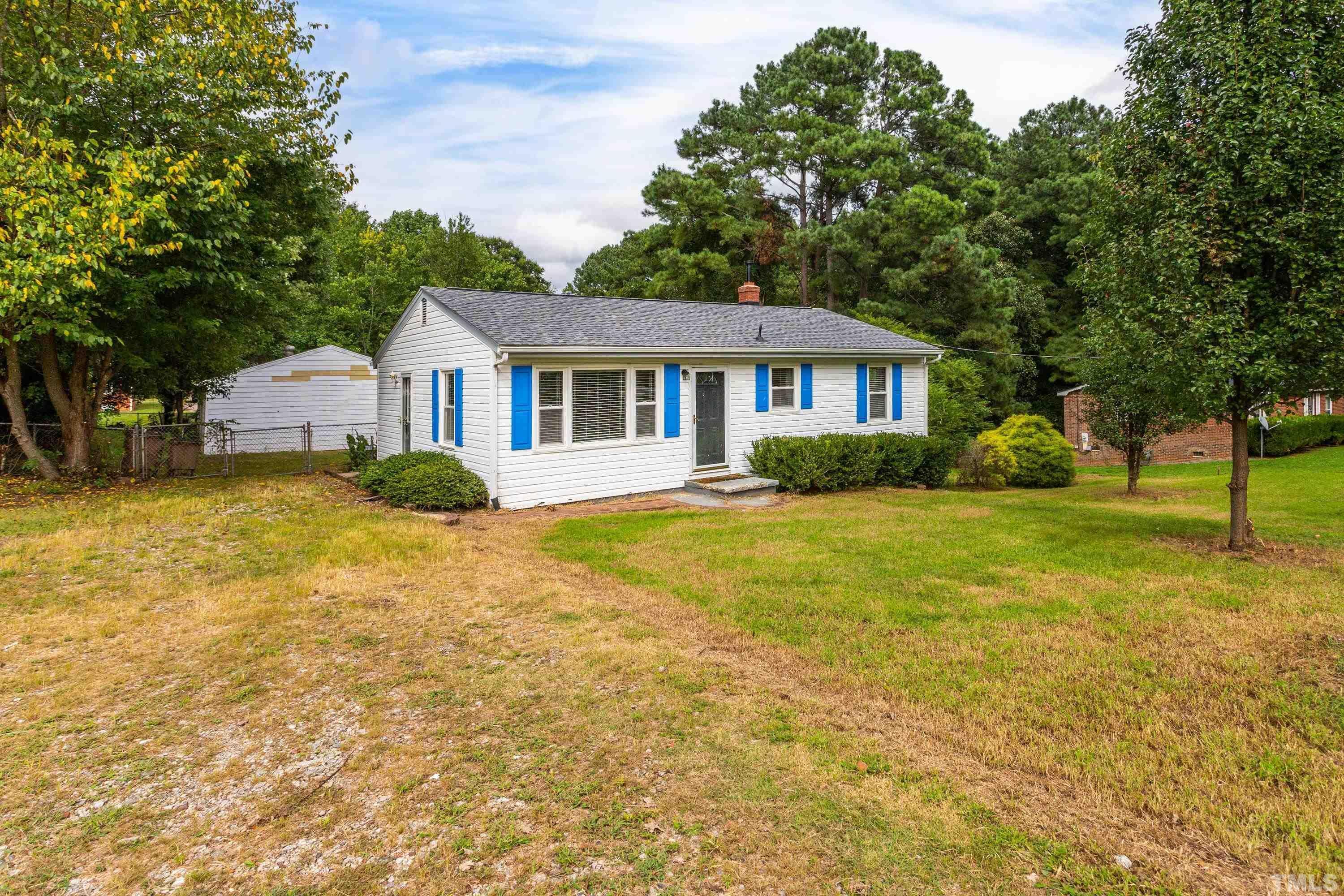143 Spring Park Road Wake Forest, NC 27587 - Photo 29 of 29 a front view of a house with garden