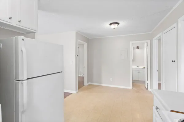 a view of a kitchen with a refrigerator and a refrigerator