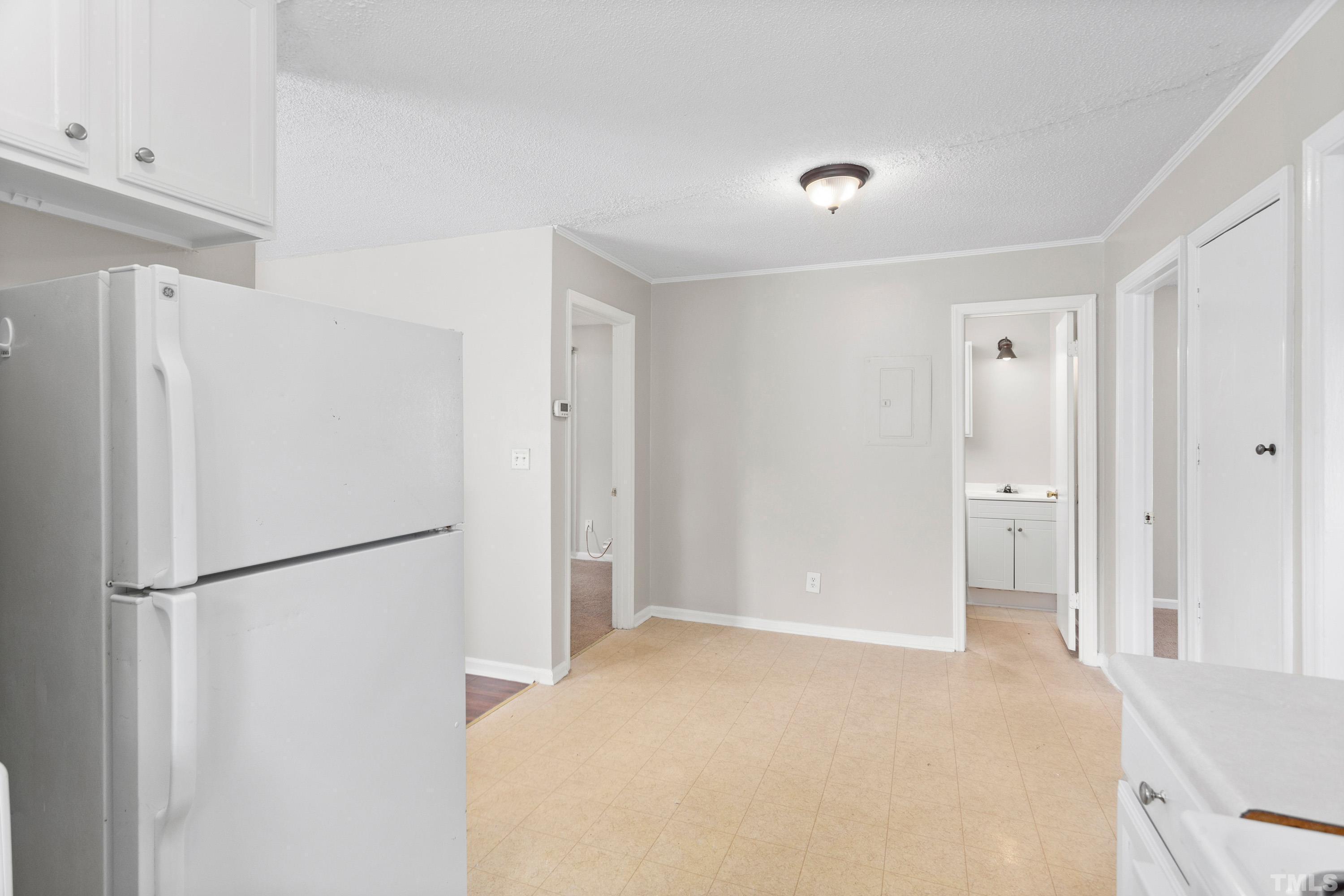 143 Spring Park Road Wake Forest, NC 27587 - Photo 5 of 29 a view of a kitchen with a refrigerator and a refrigerator