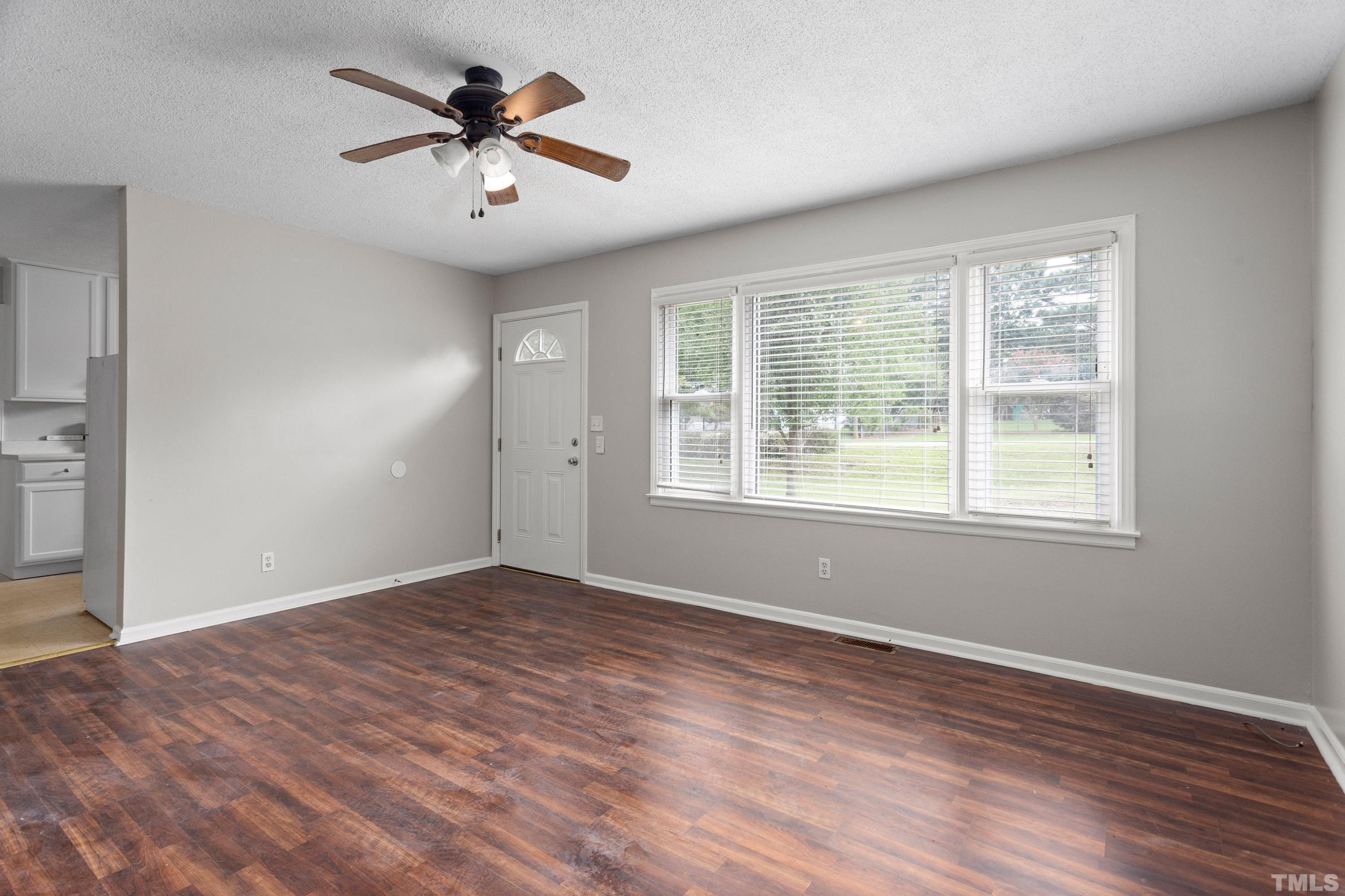 143 Spring Park Road Wake Forest, NC 27587 - Photo 6 of 29 wooden floor in an empty room with a window