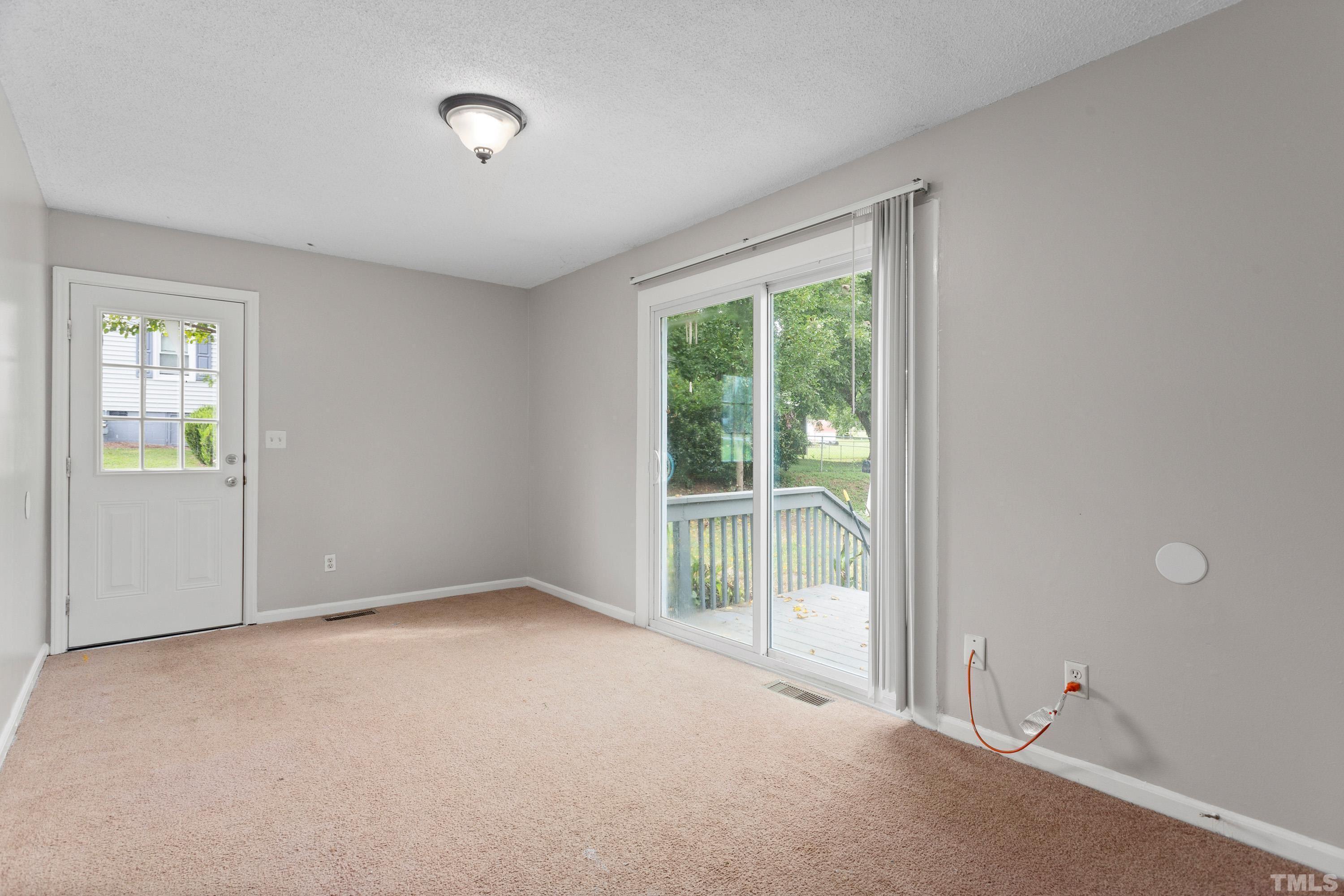 143 Spring Park Road Wake Forest, NC 27587 - Photo 8 of 29 an empty room with windows