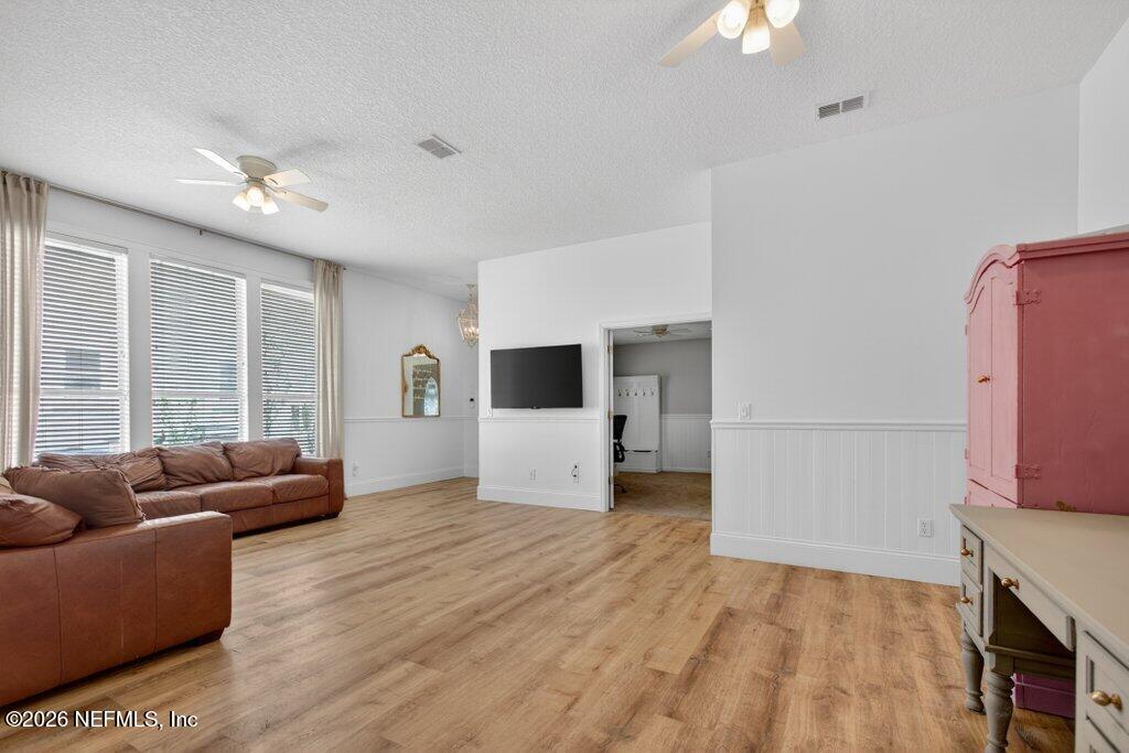 1441 Tintern Lane St. Augustine, FL 32092 - Photo 14 of 57 a living room with furniture and a flat screen tv
