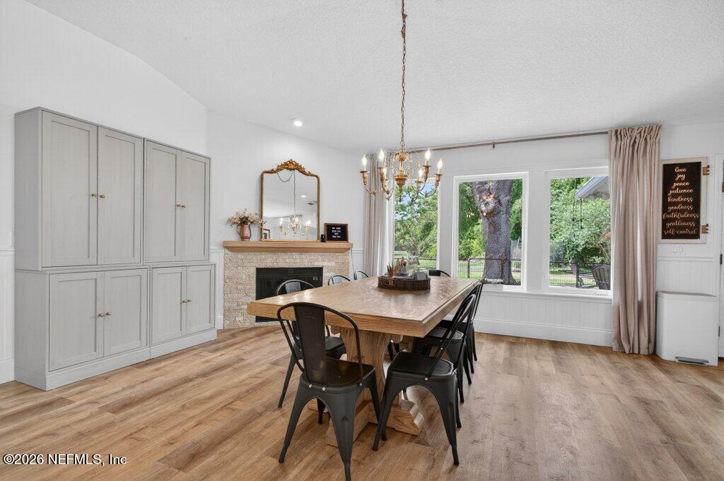1441 Tintern Lane St. Augustine, FL 32092 - Photo 15 of 57 a view of a dining room with furniture window and wooden floor