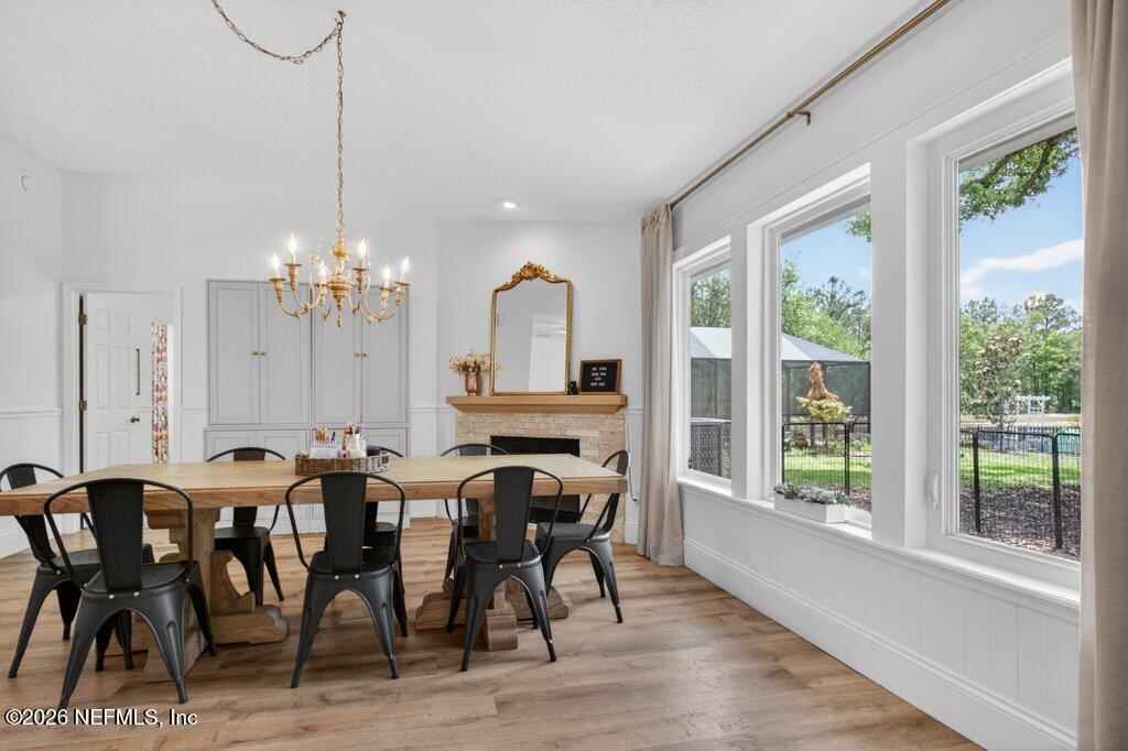 1441 Tintern Lane St. Augustine, FL 32092 - Photo 17 of 57 a view of a dining room with furniture window and wooden floor
