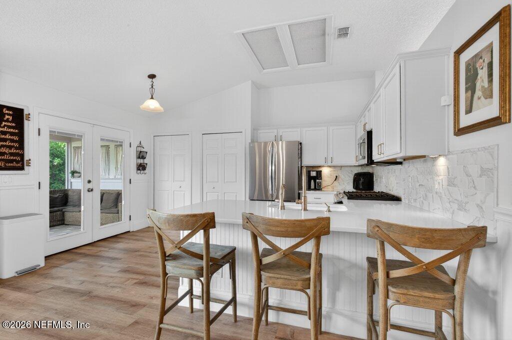 1441 Tintern Lane St. Augustine, FL 32092 - Photo 20 of 57 a view of a dining room with furniture and wooden floor