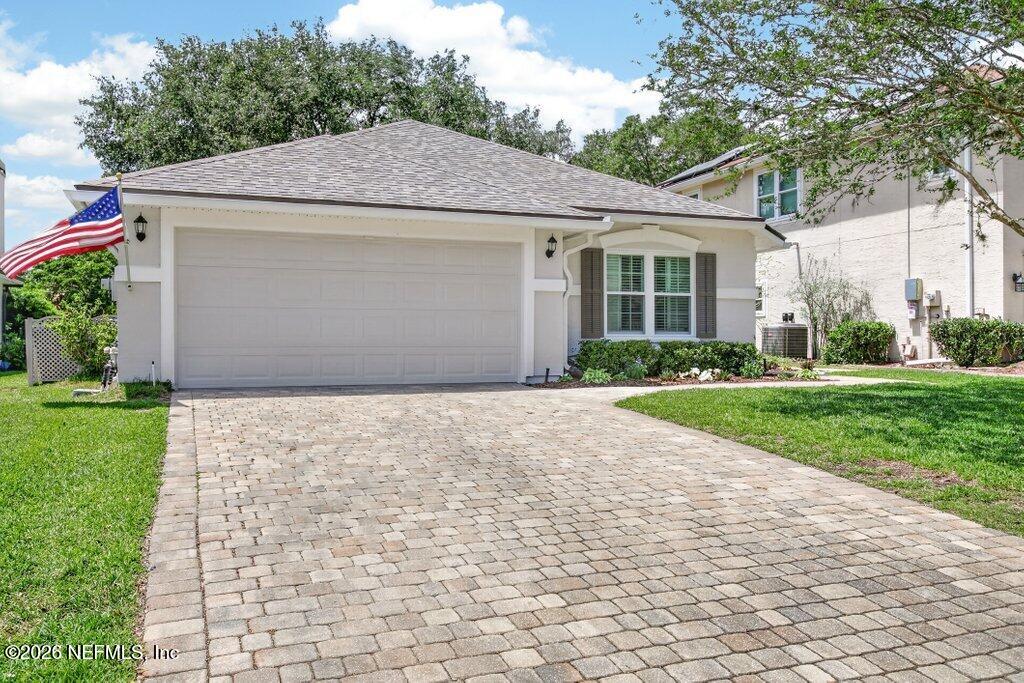 1441 Tintern Lane St. Augustine, FL 32092 - Photo 2 of 57 a aerial view of a house with yard and a garden
