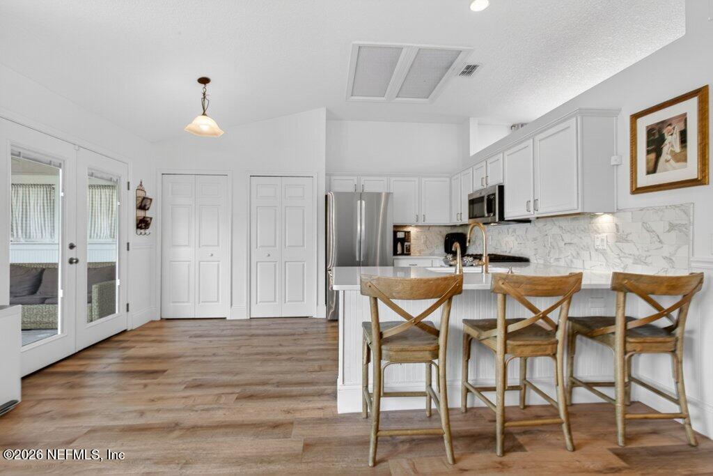 1441 Tintern Lane St. Augustine, FL 32092 - Photo 21 of 57 a view of a dining room with furniture and wooden floor