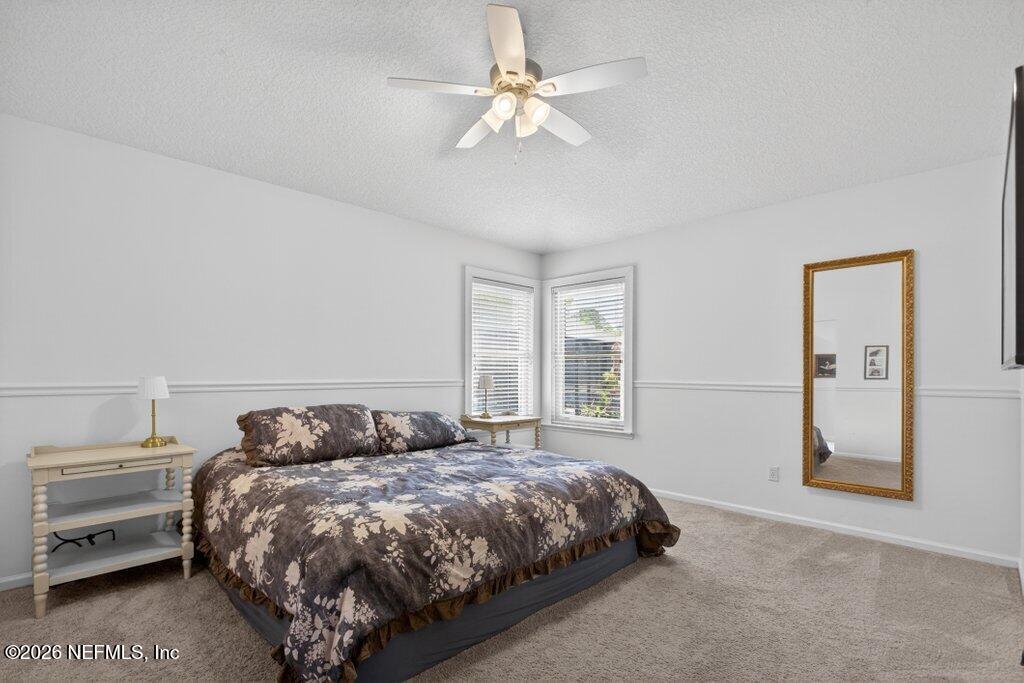 1441 Tintern Lane St. Augustine, FL 32092 - Photo 31 of 57 a bedroom with a bed and a window