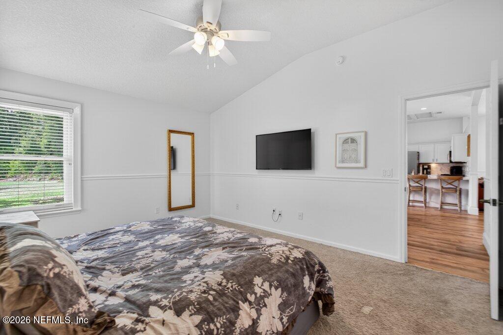 1441 Tintern Lane St. Augustine, FL 32092 - Photo 32 of 57 a bedroom with a bed and a flat screen tv