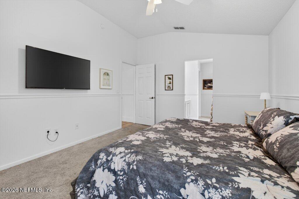 1441 Tintern Lane St. Augustine, FL 32092 - Photo 34 of 57 a bedroom with a bed and a flat screen tv