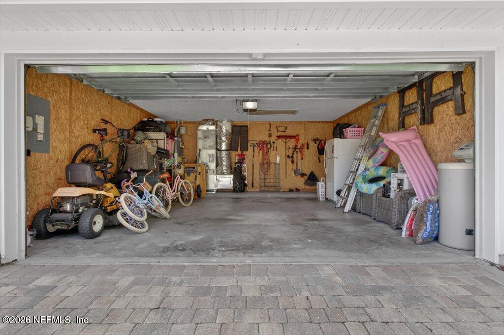 1441 Tintern Lane St. Augustine, FL 32092 - Photo 45 of 57 a view of a garage with a bike and car
