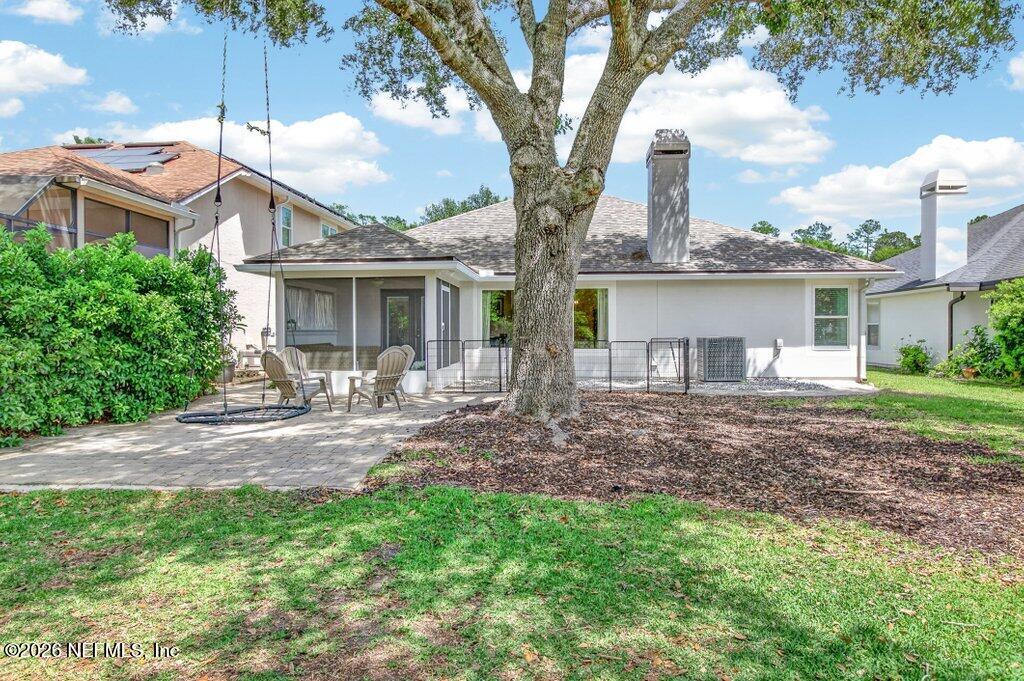 1441 Tintern Lane St. Augustine, FL 32092 - Photo 52 of 57 a front view of a house with yard porch and outdoor seating