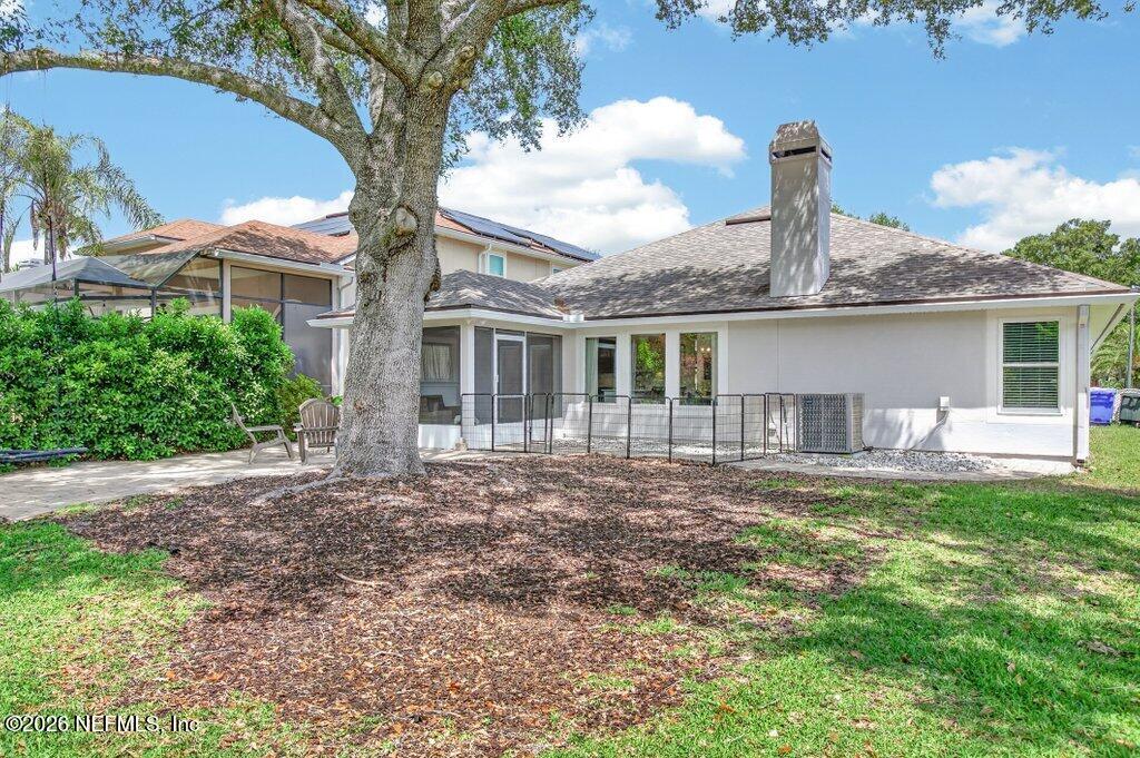 1441 Tintern Lane St. Augustine, FL 32092 - Photo 53 of 57 a front view of a house with a garden