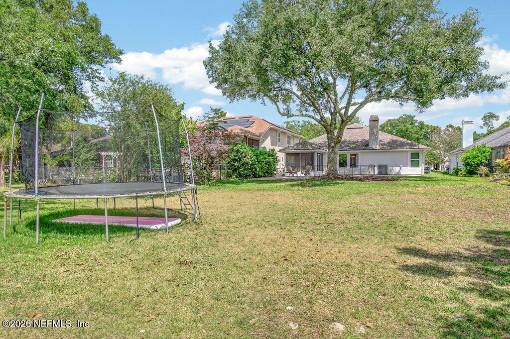1441 Tintern Lane St. Augustine, FL 32092 - Photo 54 of 57 a view of a house with a yard table and chairs
