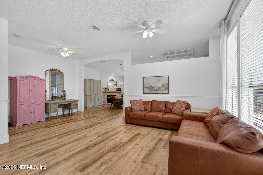 1441 Tintern Lane St. Augustine, FL 32092 - Photo 7 of 57 a living room with furniture and a fireplace