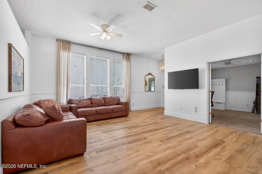 1441 Tintern Lane St. Augustine, FL 32092 - Photo 8 of 57 a living room with furniture and a flat screen tv