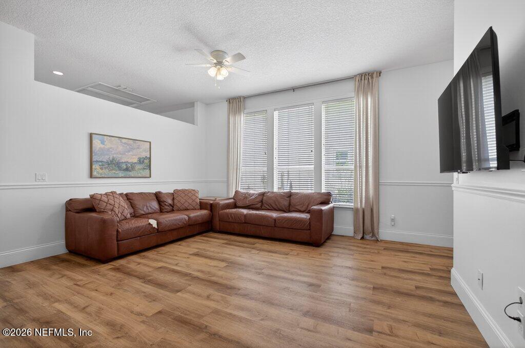 1441 Tintern Lane St. Augustine, FL 32092 - Photo 9 of 57 a living room with furniture window and a flat screen tv