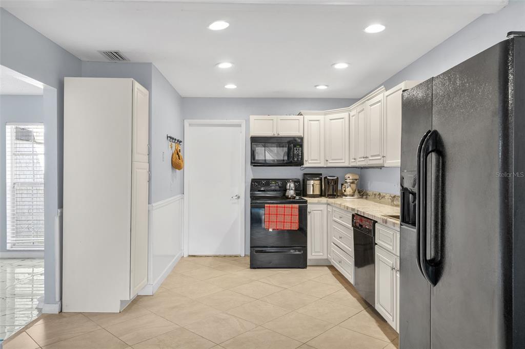 128 Euclid Avenue Seffner, FL 33584 - Photo 11 of 38 a kitchen with stainless steel appliances granite countertop a refrigerator stove and oven