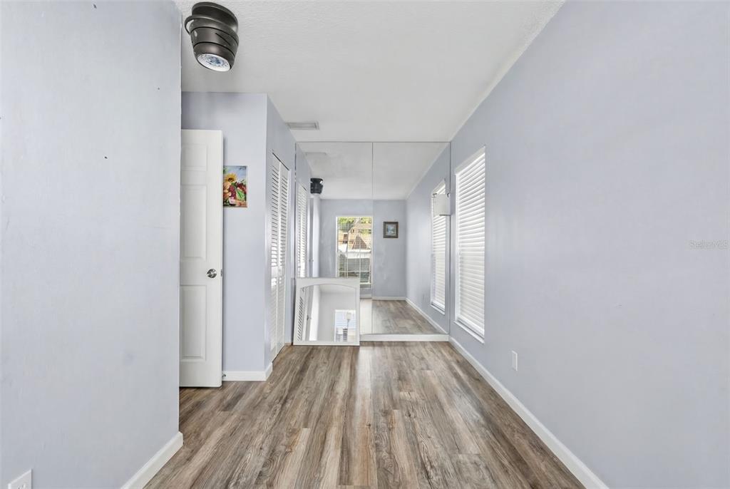 128 Euclid Avenue Seffner, FL 33584 - Photo 14 of 38 a view of a hallway with wooden floor
