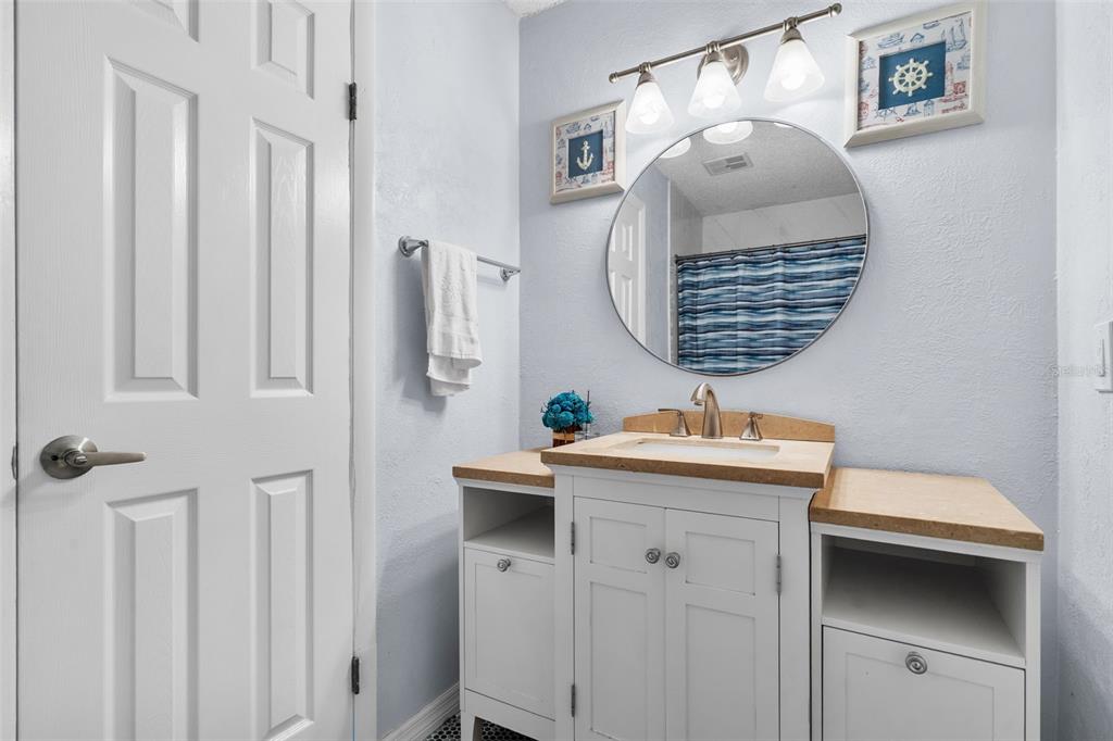128 Euclid Avenue Seffner, FL 33584 - Photo 20 of 38 a bathroom with a sink and mirror with toilet