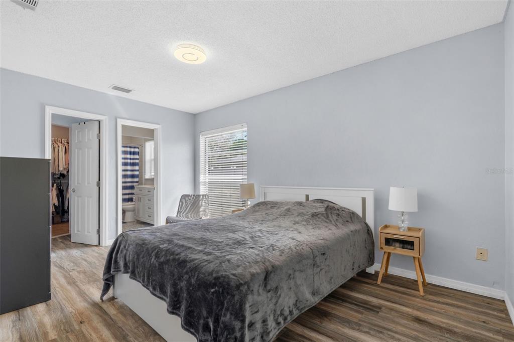 128 Euclid Avenue Seffner, FL 33584 - Photo 21 of 38 a spacious bedroom with a bed and a window