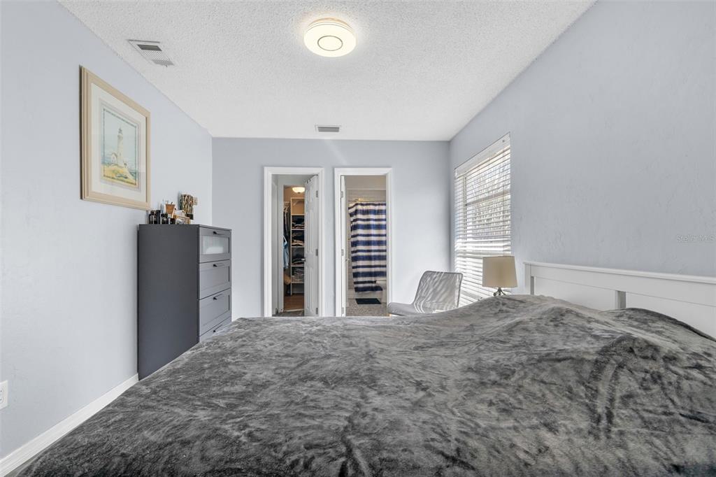 128 Euclid Avenue Seffner, FL 33584 - Photo 22 of 38 a bedroom with a bed and a large window