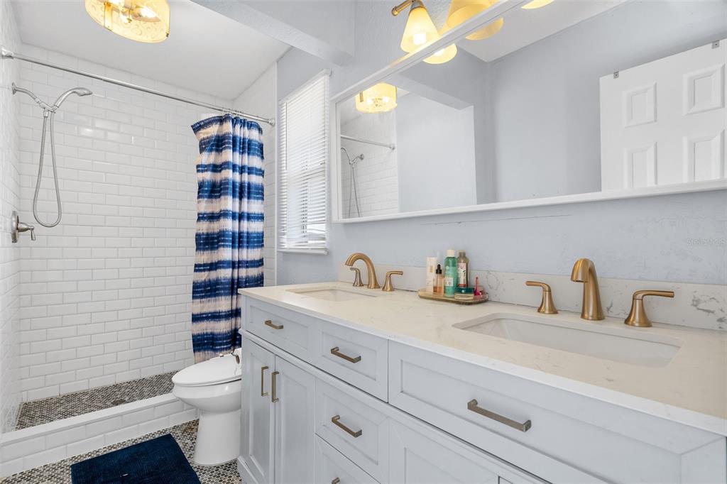 128 Euclid Avenue Seffner, FL 33584 - Photo 24 of 38 a bathroom with a sink a toilet and shower