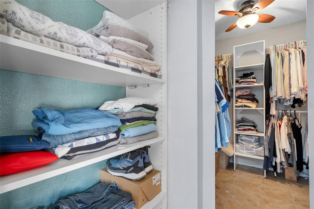 128 Euclid Avenue Seffner, FL 33584 - Photo 25 of 38 a view of walk in closet with clothes and shoes