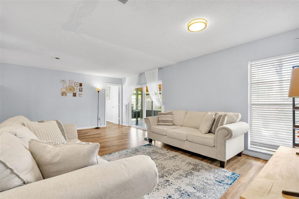 128 Euclid Avenue Seffner, FL 33584 - Photo 7 of 38 a living room with furniture and a couch