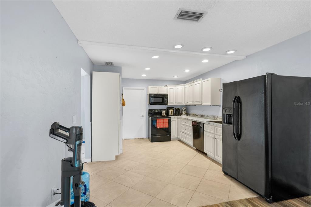 128 Euclid Avenue Seffner, FL 33584 - Photo 10 of 38 a kitchen with refrigerator and microwave