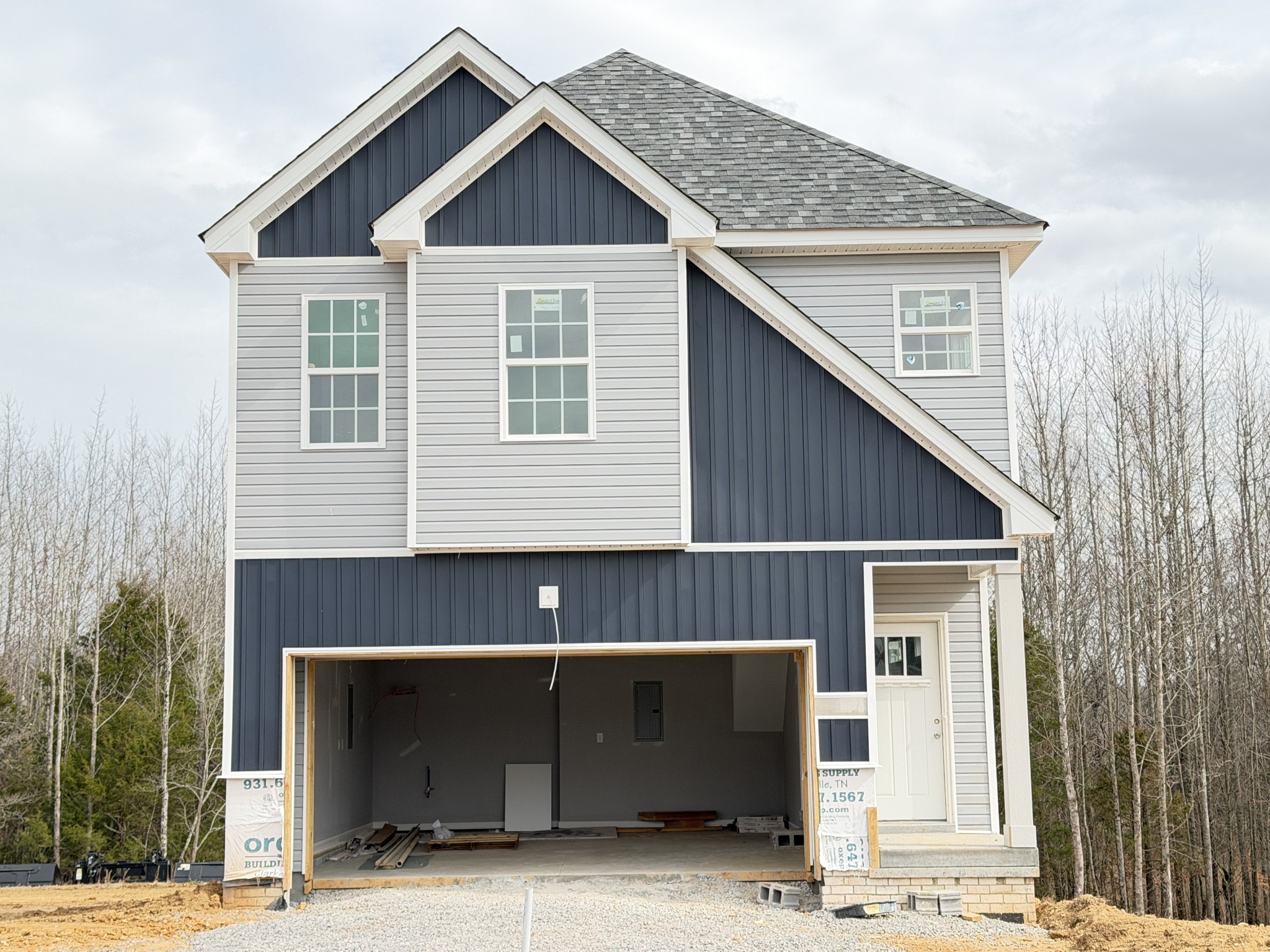 a front view of a house with garage
