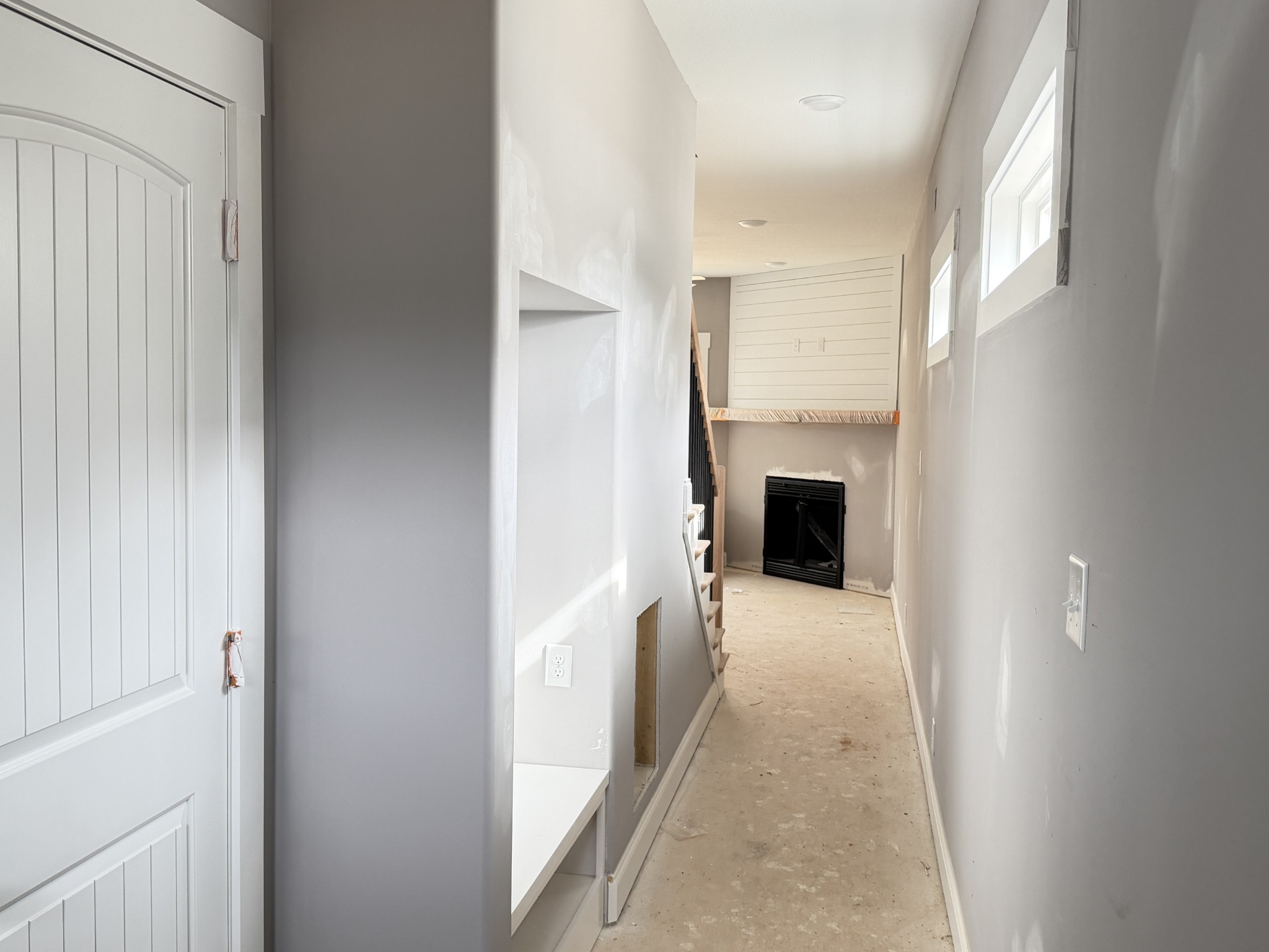 124 Hummingbird Way Clarksville, TN 37043 - Photo 3 of 12 a view of a hallway with wooden floor and staircase