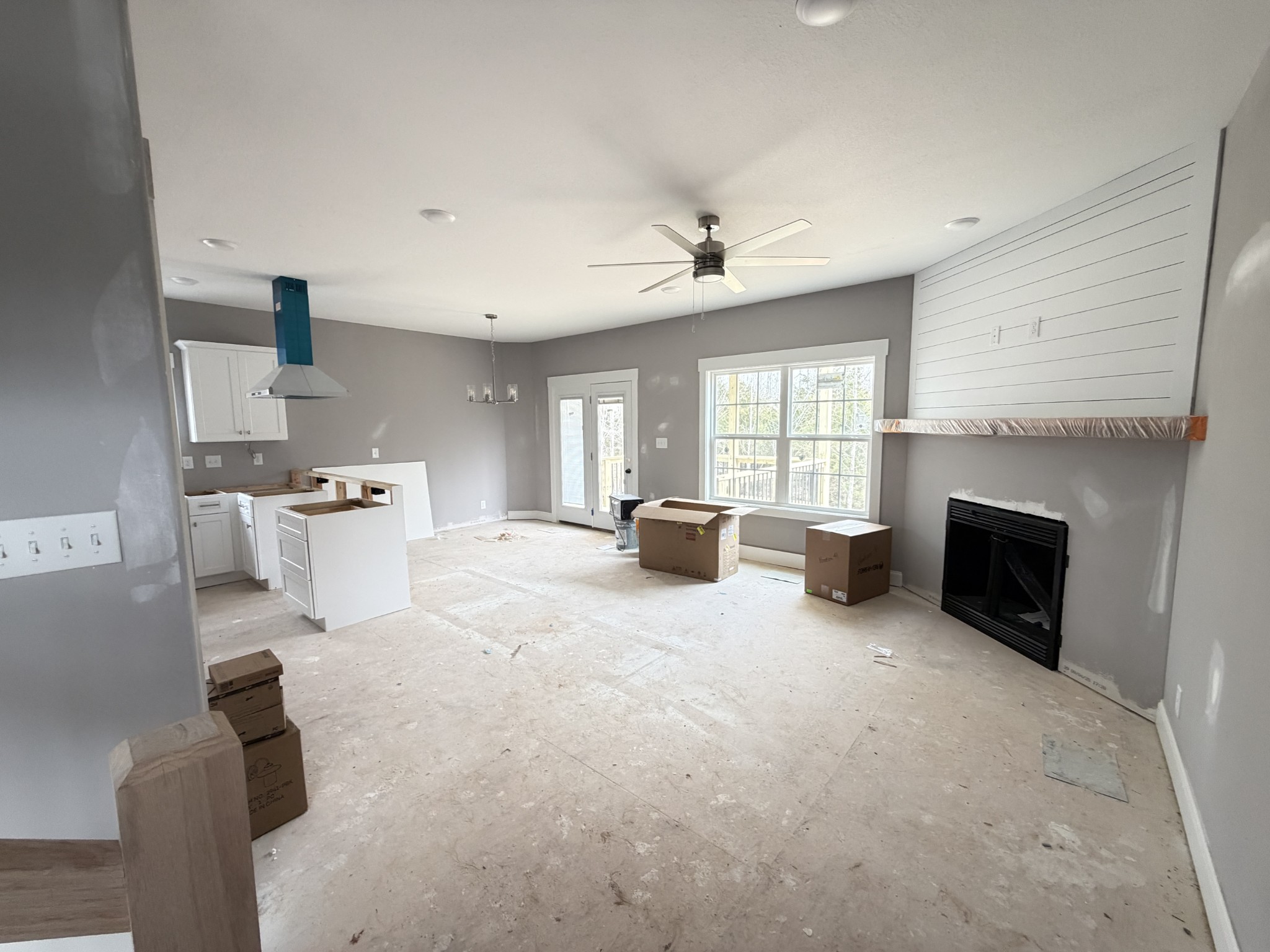 124 Hummingbird Way Clarksville, TN 37043 - Photo 5 of 12 a large white kitchen with fireplace furniture and a window