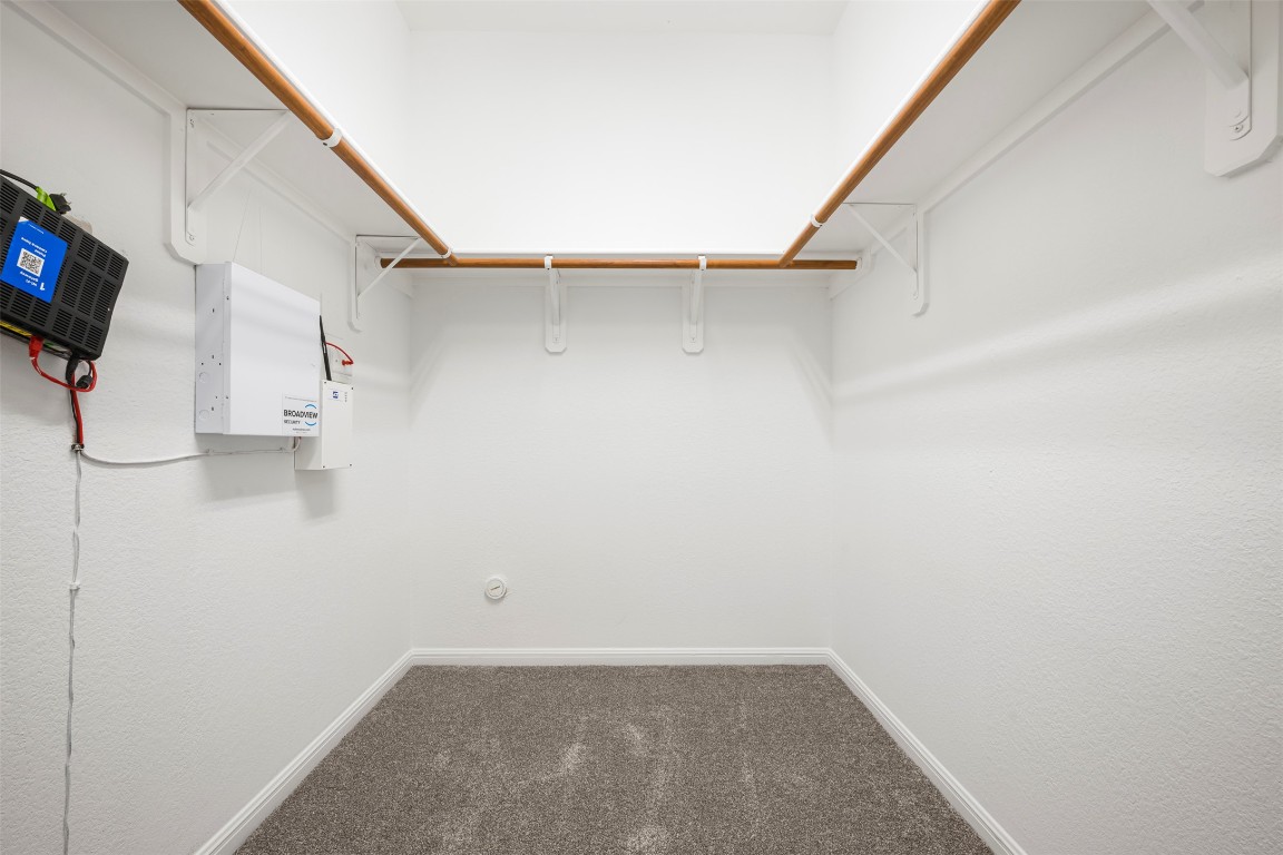 1812 Hidden Springs Path Round Rock, TX 78665 - Photo 23 of 39 a view of an empty walk in closet