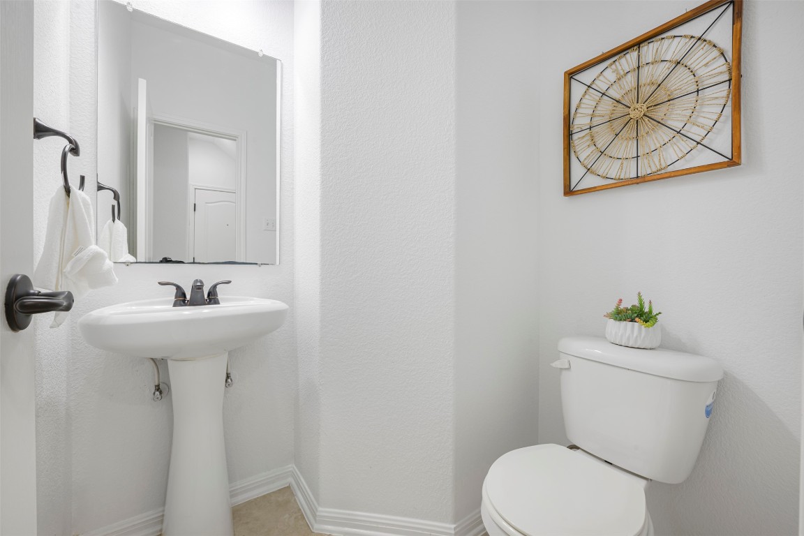 1812 Hidden Springs Path Round Rock, TX 78665 - Photo 24 of 39 a bathroom with a sink mirror and toilet