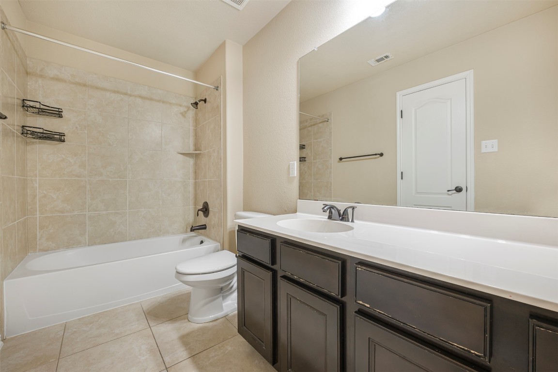 1812 Hidden Springs Path Round Rock, TX 78665 - Photo 28 of 39 a bathroom with a sink a toilet and shower
