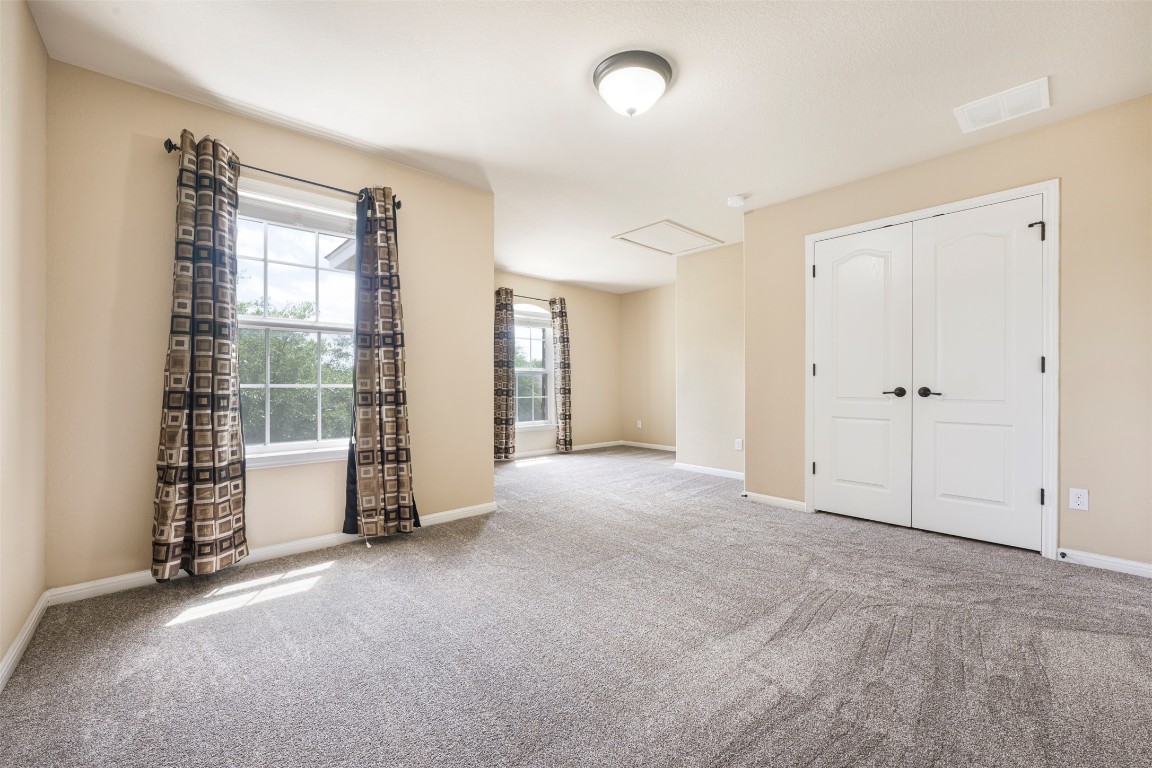 1812 Hidden Springs Path Round Rock, TX 78665 - Photo 29 of 39 an empty room with windows