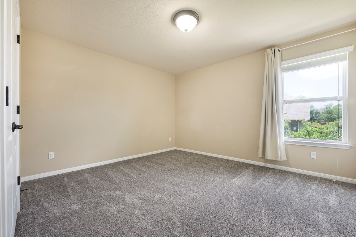 1812 Hidden Springs Path Round Rock, TX 78665 - Photo 34 of 39 an empty room with windows
