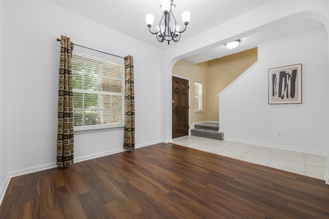 1812 Hidden Springs Path Round Rock, TX 78665 - Photo 6 of 39 a view of empty room with wooden floor and fan