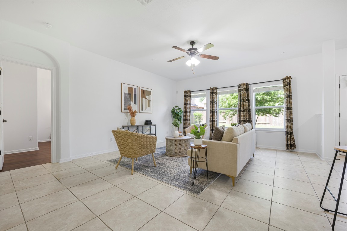 1812 Hidden Springs Path Round Rock, TX 78665 - Photo 7 of 39 a living room with a window and a table