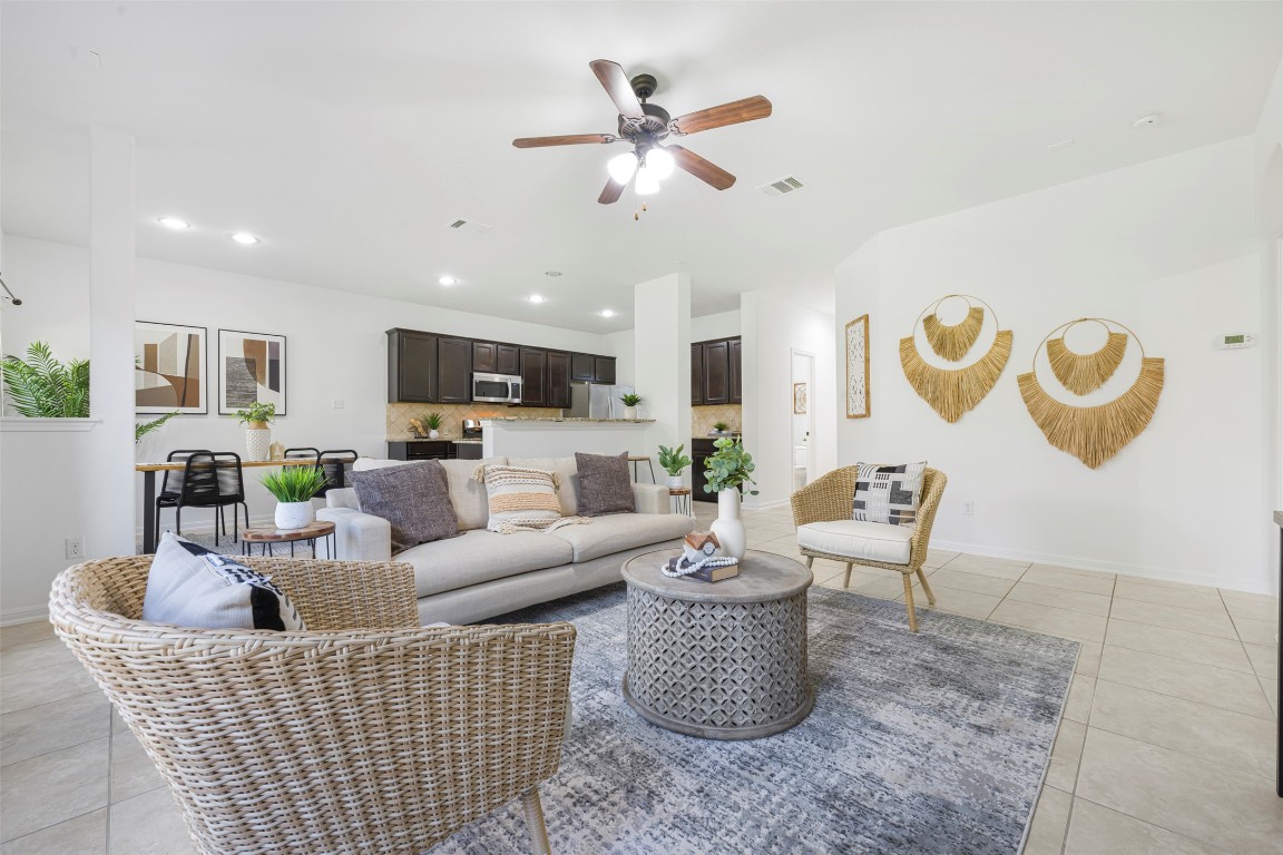 1812 Hidden Springs Path Round Rock, TX 78665 - Photo 9 of 39 a living room with furniture and a view of kitchen