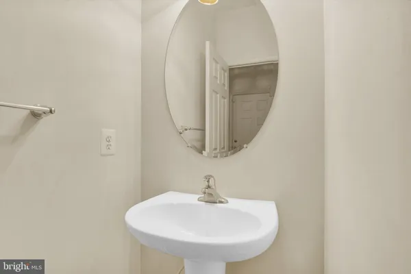 a bathroom with a sink and mirror